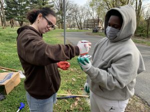 Teora and Kyleem working together to mark the local storm drains! (?) 